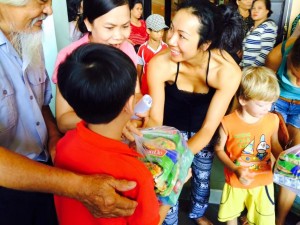 Giving food for kids in nha trang